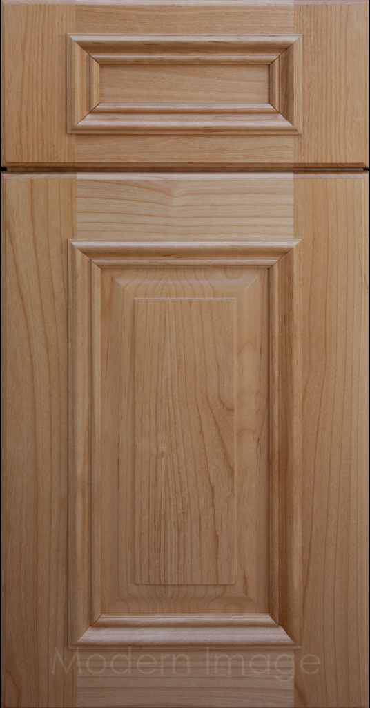 Honey stained Hamilton cabinet door with a double raised panel and mitered elevated molding.